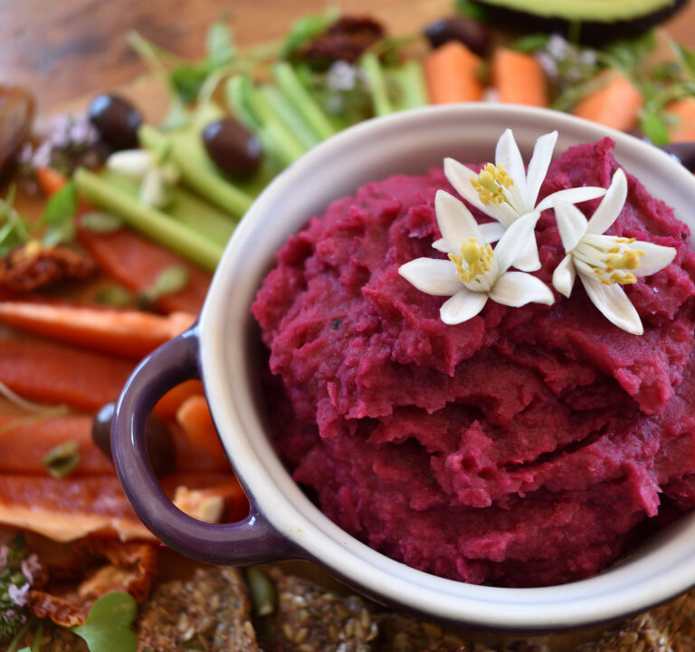 ALT="Red Beet Hummus on a vegan snack platter"